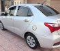 Hyundai Grand i10 MT 2018 - Cần bán gấp Hyundai Grand i10 MT 2018, màu bạc đẹp như mới