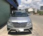 Toyota Innova E 2014 - Bán xe Toyota Innova E đời 2014, màu bạc xe gia đình