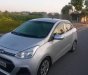 Hyundai Grand i10 1.2 2015 - Cần bán gấp Hyundai Grand i10 1.2 năm 2015, màu bạc