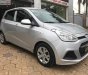 Hyundai i10 1.0MT Base 2014 - Cần bán gấp Hyundai i10 1.0MT Base 2014, màu bạc chính chủ