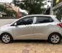 Hyundai i10 1.0MT Base 2014 - Cần bán gấp Hyundai i10 1.0MT Base 2014, màu bạc chính chủ