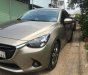 Mazda 2 2016 - Cần bán lại xe Mazda 2 2016, màu vàng số tự động