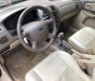 Ford Laser GHIA 1.8 AT 2003 - Cần bán Ford Laser GHIA 1.8 AT đời 2003, màu đen số tự động