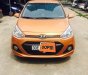 Hyundai Grand i10 1.2 AT 2016 - Cần bán xe Hyundai Grand i10 1.2 AT sản xuất năm 2016, màu cam, nhập khẩu nguyên chiếc, giá tốt