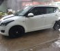 Suzuki Swift   2014 - Cần bán gấp Suzuki Swift đời 2014, hai màu, đi lại rất ít còn tốt