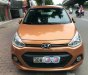 Hyundai Grand i10 1.2AT 2015 - Bán ô tô Hyundai Grand i10 1.2AT sản xuất 2015, màu cam, xe nhập đi giữ gìn