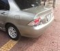 Mitsubishi Lancer 1.6 2004 - Cần bán Mitsubishi Lancer 1.6 năm 2004, màu vàng