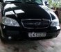 Kia Carnival GS 2.5 MT 2006 - Bán Kia Carnival GS 2.5 MT sản xuất 2006, màu đen, xe gia đình