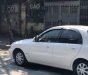 Daewoo Lanos SX 2004 - Cần bán xe Daewoo Lanos SX sản xuất 2004, màu trắng 