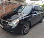 Kia Carnival 2.7 MT 2010 - Bán Kia Carnival 2.7 MT năm 2010, màu đen, nhập khẩu nguyên chiếc  