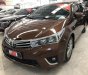 Toyota Corolla altis 1.8G MT 2014 - Bán gấp Toyota Corolla altis 1.8G MT sản xuất 2014, màu nâu số sàn, giá chỉ 620 triệu