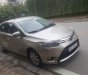 Toyota Vios E 2015 - Chính chủ bán xe Toyota Vios E sản xuất 2015, màu vàng cát