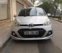 Hyundai Grand i10 1.0MT 2015 - Cần bán lại xe Hyundai Grand i10 1.0MT đời 2015, màu bạc, xe còn mới và nguyên bản toàn bộ