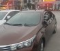 Toyota Corolla altis 1.8G MT 2015 - Bán Toyota Corolla altis 1.8G MT đời 2015, màu nâu, đẹp như mới