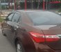 Toyota Corolla altis 1.8G MT 2015 - Bán Toyota Corolla altis 1.8G MT đời 2015, màu nâu, đẹp như mới