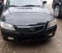 Mazda 323   2002 - Cần bán Mazda 323 đời 2002, màu đen, xe đẹp nguyên bản