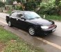 Kia Spectra 2004 - Bán Kia Spectra sản xuất năm 2004, màu đen xe gia đình