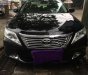 Toyota Camry 2.0E 2013 - Cần bán lại xe Toyota Camry 2.0E năm 2013, màu đen còn mới