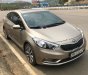 Kia K3 2015 - Cần bán lại xe Kia K3 đời 2015, màu vàng