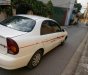 Daewoo Lanos SX 2004 - Gia đình cần bán Daewoo Lanos SX đời 2004, màu trắng, giá 72tr