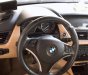 BMW X1 2010 - Cần bán xe BMW X1 2010, màu trắng xe gia đình