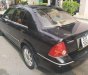 Ford Laser GHIA 1.8 AT 2004 - Cần bán xe Ford Laser GHIA 1.8 AT đời 2004, màu đen chính chủ