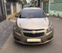 Chevrolet Cruze 2010 - Gia đình cần bán Cruze 2010, số sàn, màu vàng cát