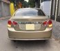 Chevrolet Cruze 2010 - Gia đình cần bán Cruze 2010, số sàn, màu vàng cát