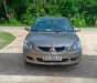 Mitsubishi Lancer 2003 - Bán Mitsubishi Lancer sản xuất năm 2003, màu vàng, nhập khẩu