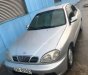 Daewoo Lanos 2003 - Cần bán gấp Daewoo Lanos sản xuất 2003, màu bạc