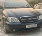 Kia Carnival LS 2.5 AT 2009 - Bán Kia Carnival LS 2.5 AT đời 2009, màu đen, số tự động