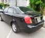 Daewoo Lacetti EX 2005 - Nhà bán Daewoo Lacetti EX đời 2005, màu đen số sàn
