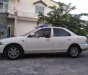 Mazda 323 1999 - Cần bán gấp Mazda 323 sản xuất năm 1999, màu trắng, nhập khẩu