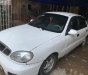 Daewoo Lanos SX 2002 - Cần bán gấp Daewoo Lanos SX đời 2002, màu trắng số sàn