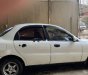 Daewoo Lanos SX 2002 - Cần bán gấp Daewoo Lanos SX đời 2002, màu trắng số sàn