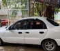 Daewoo Lanos SX 2002 - Cần bán gấp Daewoo Lanos SX đời 2002, màu trắng số sàn