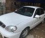 Daewoo Lanos SX 2002 - Cần bán gấp Daewoo Lanos SX đời 2002, màu trắng số sàn