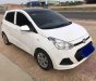 Hyundai Grand i10    MT 2014 - Cần bán Hyundai Grand i10 MT sản xuất 2014, màu trắng, nhập khẩu xe gia đình