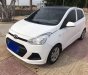 Hyundai Grand i10    MT 2014 - Cần bán Hyundai Grand i10 MT sản xuất 2014, màu trắng, nhập khẩu xe gia đình