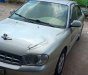 Kia Spectra 2004 - Cần bán gấp Kia Spectra 2004, màu bạc xe nguyên bản