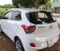 Hyundai Grand i10 2015 - Cần bán gấp Hyundai Grand i10 đời 2015, màu trắng, xe nhập xe gia đình