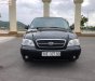 Kia Carnival 2.4 2009 - Bán Kia Carnival 2.4 sản xuất năm 2009, màu đen xe gia đình, 245tr