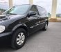 Kia Carnival 2.4 2009 - Bán Kia Carnival 2.4 sản xuất năm 2009, màu đen xe gia đình, 245tr