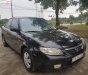 Mazda 323 2002 - Cần bán lại xe Mazda 323 sản xuất 2002, màu đen xe nguyên bản