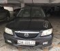 Mazda 323 2003 - Cần bán lại xe Mazda 323 đời 2003, màu đen xe còn chạy êm