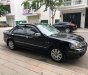 Ford Laser   2004 - Bán Ford Laser GHIA 1.8 AT sản xuất 2004, màu đen, số tự động 