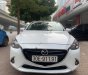 Mazda 2 1.5 AT 2015 - Xe Mazda 2 1.5 AT năm 2015, màu trắng chính chủ giá cạnh tranh