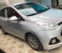 Hyundai Grand i10  1.0 MT 2015 - Cần bán gấp Hyundai Grand i10 1.0 MT năm 2015, màu bạc, nhập khẩu nguyên chiếc 