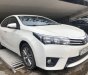 Toyota Corolla 2015 - Cần bán gấp Toyota Corolla sản xuất năm 2015, màu trắng số tự động, 570 triệu