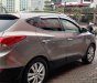 Hyundai Tucson 2.0  2011 - Cần bán xe Hyundai Tucson 2.0 AT 4WD 2011, màu ghi